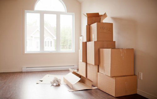 Furniture and boxes being loaded into a van for transport