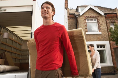 Removal van and moving team in East Dulwich residential street