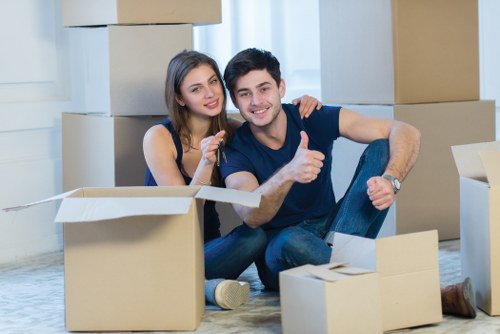 Movers handling boxes and furniture during a local East Dulwich relocation