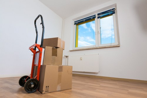 Local removals crew handling boxes and furniture near East Dulwich