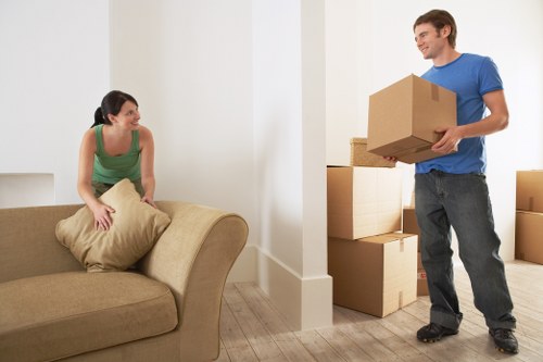 Professional movers handling furniture in a typical East Dulwich property